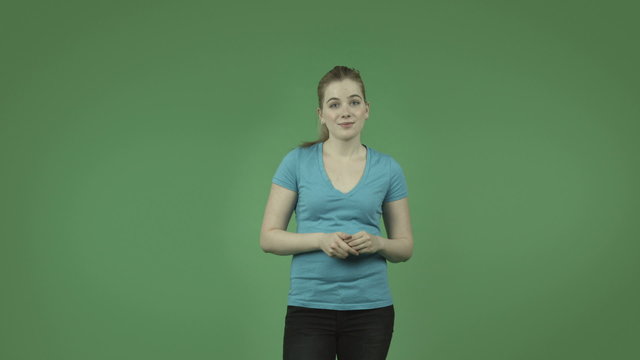 attractive caucasian casual girl presenting isolated on green