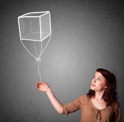 Woman holding a cube balloon