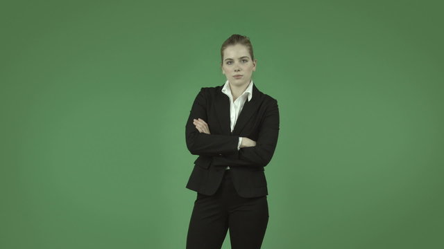 attractive caucasian business girl isolated on green upset