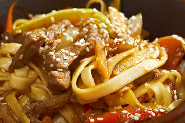 Cooking udon teppanyaki with pork