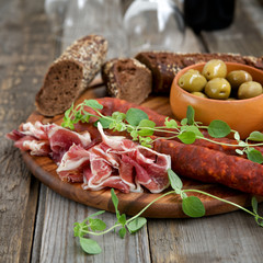 Spanish tapas - jamon, chorizo ​​and olives