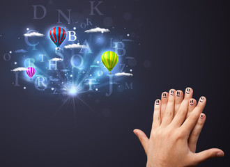 Happy smiley fingers looking at hot air balloons in the cloudy s