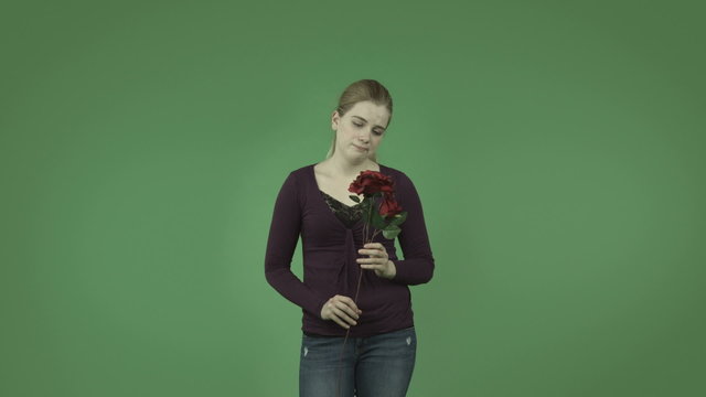attractive casual caucasian girl isolated on green depressed