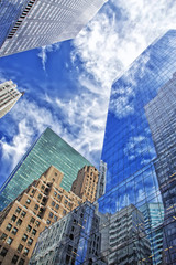 Skyscrapers with clouds reflection