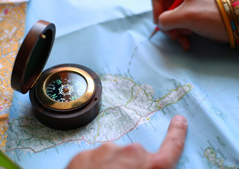 Route on the map with the help of a compass, travel