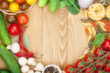 Fototapeta na wymiar Fresh ingredients for cooking: pasta, tomato, cucumber, mushroom