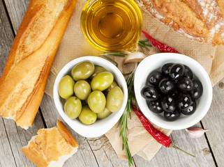 Italian food appetizer of olives, bread and spices