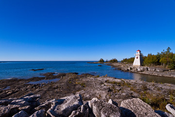 Lighthouse with blue sky as background