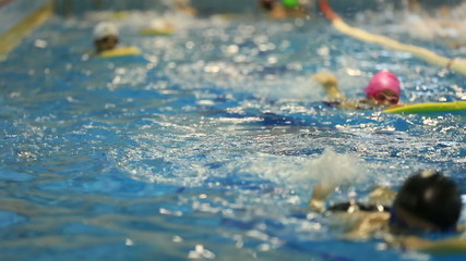 little child training in swim pool