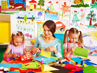 Fototapeta premium Children with teacher at classroom.