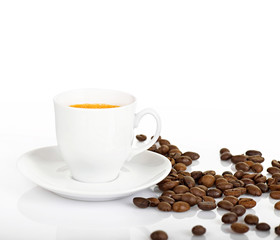 Coffee cup and coffee beans on a white background