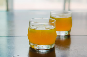 close up of orange juice with ice