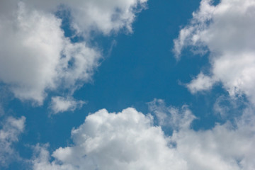 Clear Blue Sky with large white clouds