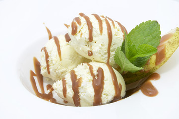 three scoops of ice cream with caramel sauce