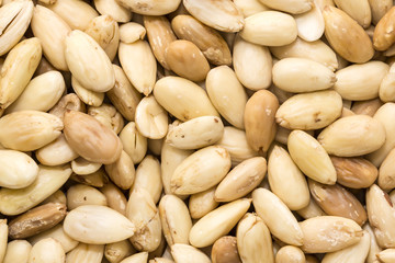 Background of peeled almonds closeup shot