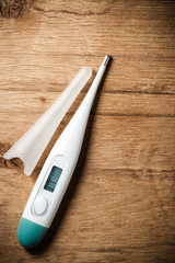 Medical background. Electronic thermometer.