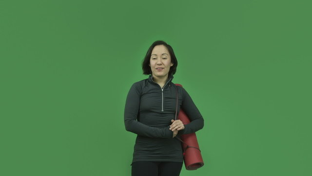 caucasian sporty girl isolated on green screen talking interview