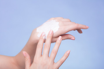 Skin care. Female palms with moisturizing cream.