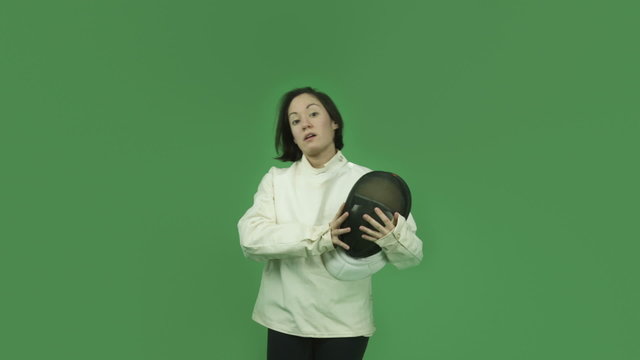 caucasian fencing with sword girl isolated on green screen