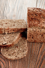 Slices of brown bread on a wooden table
