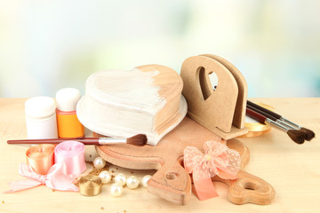 Handmade wooden box and art materials for decor, on table