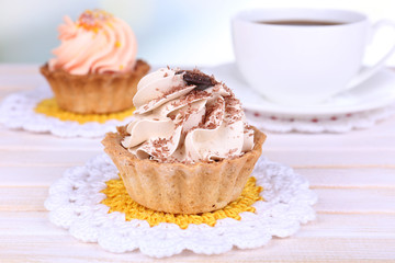Tasty cakes on table on light background