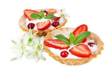 Tasty tartlets with strawberries isolated on white