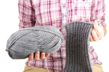 Female hands knitting with spokes close up