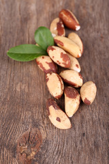 Tasty brasil nuts on wooden background