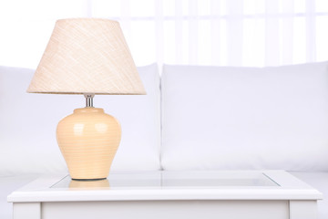 Lamp on coffee table in room