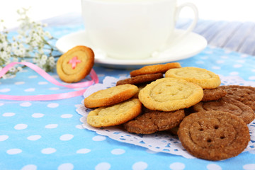 Sugar cookies in shape of buttons on table