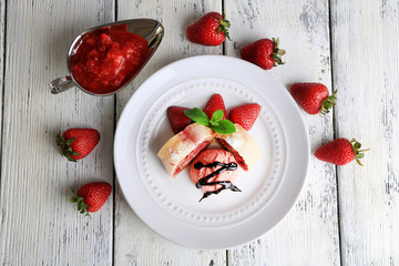 Tasty homemade strudel with ice-cream, fresh strawberry and