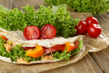 Veggie wrap filled with chicken and fresh vegetables