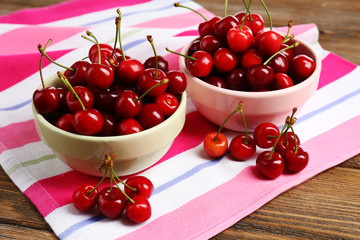 Obraz na płótnie Canvas Sweet cherries on wooden table
