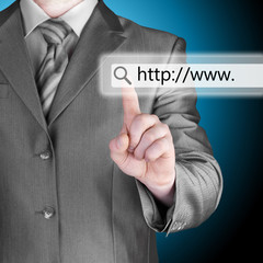 Businessman pushing virtual search bar