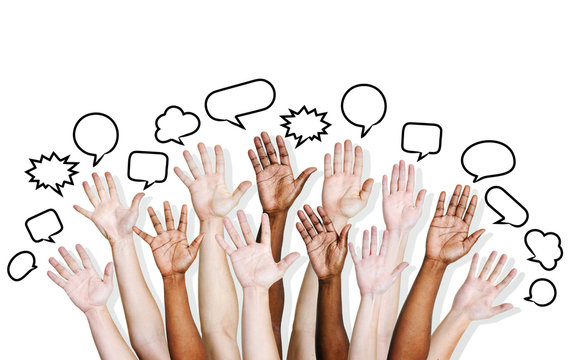 Multi Ethnic People's Hands Raised With Speech Bubble