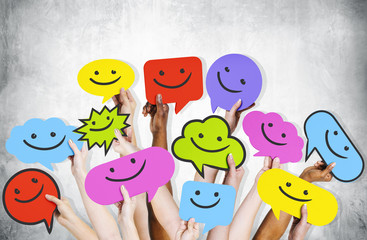 Hands Holding Smiley Faces Icons