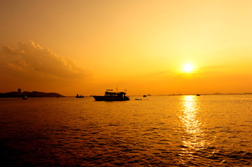 Fototapeta na wymiar Ship at Silhouette Sunset