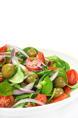 Salad of lamb's lettuce, olives, paprika, tomato and onion