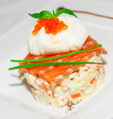 Salad with boiled vegetable, spicy salmon and egg on plate,