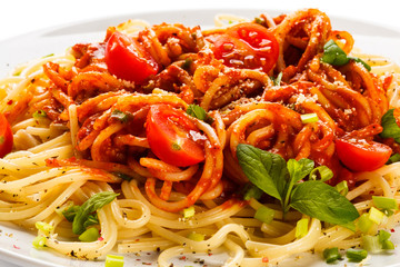 Pasta with meat, tomato sauce, parmesan and vegetables