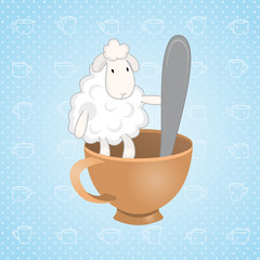 lamb sitting in a cup with a spoon