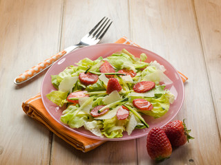 salad with lettuce zucchinis parmesan cheese and strawberries