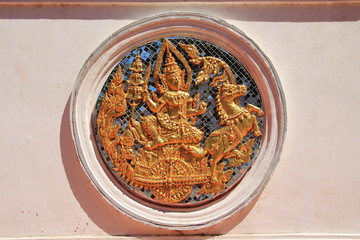 statue of Surya in a thai architectural