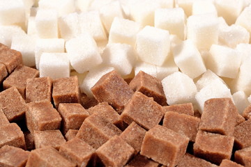 Heap of brown and white refined sugar