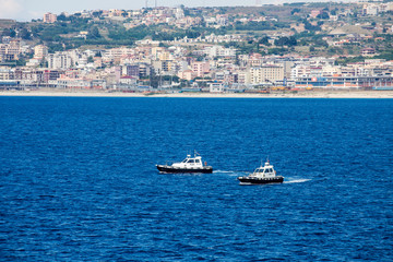 Obraz premium Two Pilot Boats in Blue Water Off Italian Coast