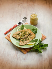 breaded cutlet with herbs and mustard