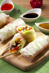 Portion of spring rolls on a bamboo board