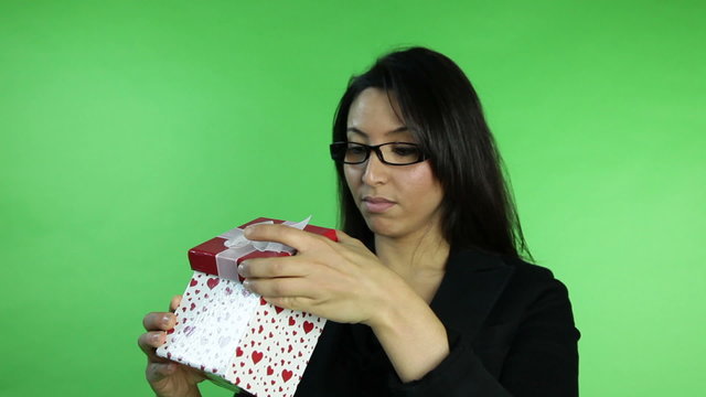 business woman isolated on green screen upset with gift