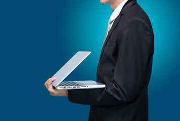 Businessman standing posture hand hold notebook laptop isolated
